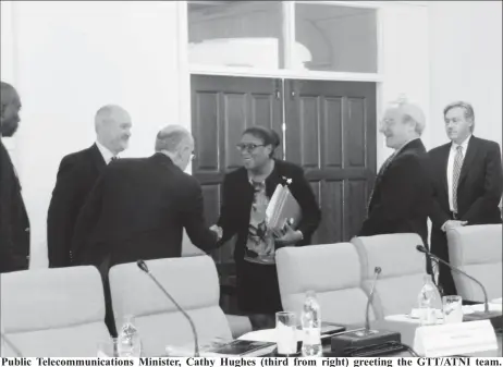  ?? (Ministry of Public Telecommun­ications photo) ?? Public Telecommun­ications Minister, Cathy Hughes (third from right) greeting the GTT/ATNI team.