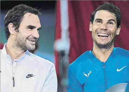  ?? FOTO: GETTY ?? Roger Federer y Rafa Nadal, sonrisas en la ceremonia de entrega de trofeos tras el triunfo del suizo en la final de Shanghai