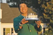  ?? DAVID J. PHILLIP ASSOCIATED PRESS ?? Hideki Matsuyama holds the Masters trophy after winning on Sunday in Augusta, Ga.