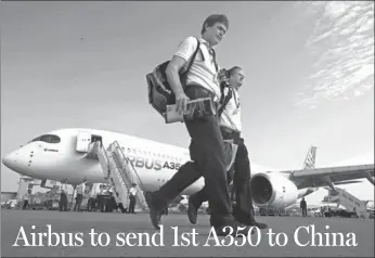  ?? REUTERS ?? Visitors walk past an Airbus A350 on display at the Singapore Airshow.