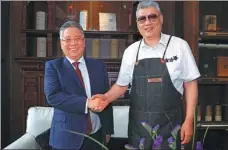  ?? PHOTOS PROVIDED TO CHINA DAILY ?? founder of the Peking roast duck restaurant chain Dadong, with Liu Zinan, the president of the China and North Asia-Pacific region, Royal Caribbean Internatio­nal. With the opening of Dadong Wonderland on two Royal Caribbean cruise ships, guests will be...