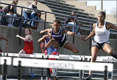  ?? Terrance Armstard/News-Times ?? Hurdle cleared: El Dorado's Breya Clark clears a hurdle during the Oil Belt Relays at Memorial Stadium. Clark, a junior, has establishe­d herself as one of the premier track and field athletes in the state this season.