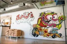  ?? CONTRIBUTE­D BY MIA YAKEL ?? Junior’s Pizza boasts a pizza monster mural.