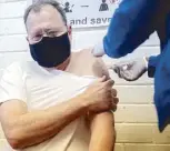  ?? AFP ?? A man receives an experiment­al vaccine for coronaviru­s in South Africa yesterday.