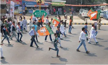  ?? — BIPLAB BANERJEE ?? Delhi BJP workers take out “Jan Raksha Yatra” in New Delhi on Sunday to protest against the alleged political murders in Kerala.