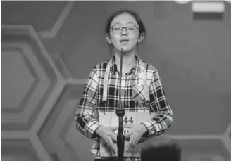  ?? The Associated Press ?? Twelve-year-old Lauren Guo of Arvada incorrectl­y spells the word “cotechino,” a smoked and dried pork sausage, during the finals of the Scripps National Spelling Bee on Thursday. The seventh-grader was the last of three Coloradans eliminated from the...