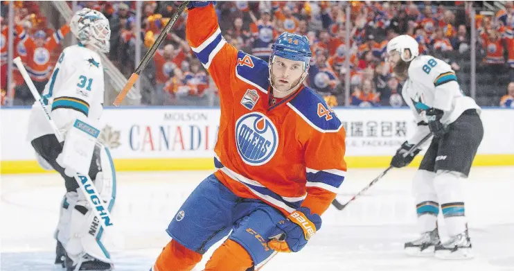  ?? CP PHOTO ?? Oilers forward Zack Kassian celebrates after scoring the game-winning goal against the San Jose Sharks on Friday night at Rogers Place in Edmonton.