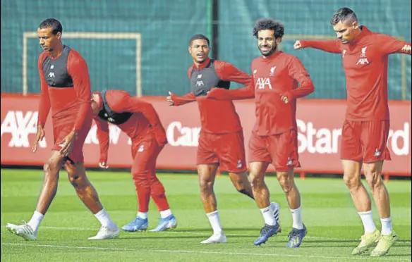  ?? AFP ?? Liverpool players take part in a training session at their Melwood complex, Liverpool, on the eve of their Champions League group stage match against Napoli.