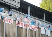  ?? MIKE WAKEFIELD, NORTH SHORE NEWS ?? Lynn Valley Care Centre staff thank the community members who showed up to cheer them on during a nightly 7 p.m. health-care workers’ salute in April. The centre suffered 20 COVID-19 deaths despite a record of few past problems