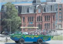  ?? ANDREW VAUGHAN/THE CANADIAN PRESS ?? The Harbour Hopper carries a load of tourists through downtown Halifax. The Vietnam War-era amphibious vehicle also provides a water view of Nova Scotia’s capital.