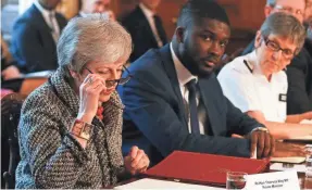  ?? ADRIAN DENNIS/AP ?? British Prime Minister Theresa May calls knife crime a public health emergency. A record 285 people were killed in knife-related homicides.