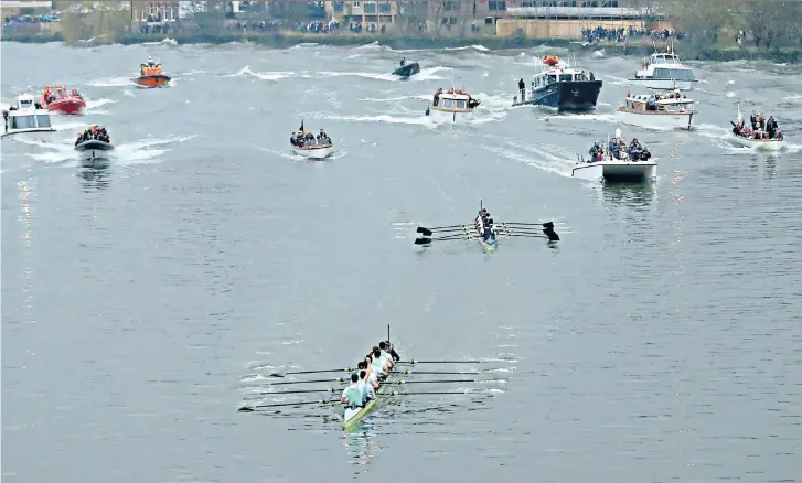  ??  ?? No way back: ‘It took us a long time to get our rhythm and by then the race was lost,’ said Sean Bowden, coach of the Oxford crew, who are pictured trailing in the wake of their Cambridge rivals yesterday