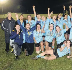  ??  ?? That winning feeling . . . University players and staff celebrate winning the Dunedin women’s club rugby final at Logan Park on Saturday.