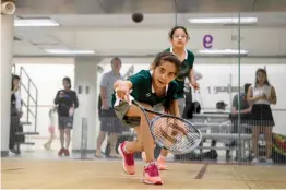  ?? — AFP ?? Squash Dreamers’ Sabah Husryeh ( front) and Eman Hassan in action during the Hong Kong junior squash tournament on Thursday. Three Syrian squash players, aged between 11 and 13, are part of a new team called Squash Dreamers, made up of displaced Syrian...