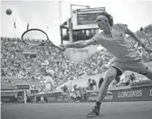  ?? ERIC FEFERBERG/GETTY IMAGES ?? Alexander Zverev returns the ball to Karen Khachanov during their men's singles fourth-round match at the French Open on Sunday.