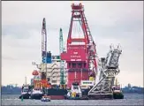  ??  ?? In this file photo, tugboats get into position on the Russian pipe-laying vessel ‘Fortuna’ in the port of Wismar, Germany. Russia’s state-controlled gas giant said Friday Sept 10, 2021, it has completed the constructi­on of the Nord Stream 2 gas pipeline to Germany, a contentiou­s project that Ukraine and the United States have strongly opposed.