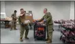  ?? PHOTO PROVIDED ?? New York National Guard members help deliver food donated from the Regional Food Bank of Northeaste­rn New York to those under quarantine.