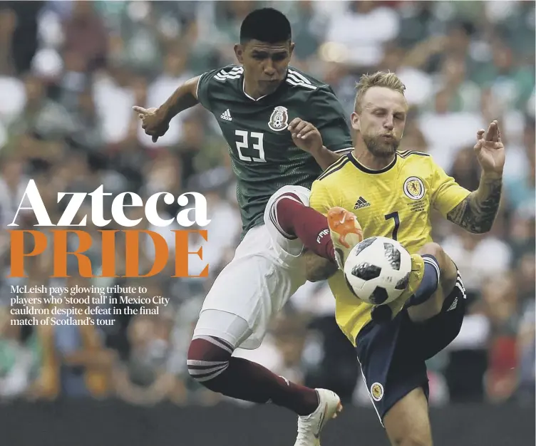  ??  ?? 0 Johnny Russell feels the pain of a challenge from Jesus Gallardo in Scotland’s 1-0 defeat by World Cup-bound Mexico in the Azteca Stadium yesterday.
Reaction and report: Pages 2-4