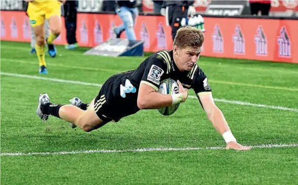  ??  ?? This one got past the TMO. Hurricanes Jordie Barrett scores a try during the Hurricanes vs Sunwolves Super Rugby match.