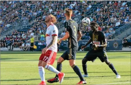  ?? MIKEY REEVES — FOR DIGITAL FIRST MEDIA ?? The Union’s Derrick Jones controls the ball while teammate Jack Elliott (3) keeps the Red Bulls’ Daniel Royer (77) at a safe distance. Jones was shown a red card for a dangerous tackle in the 53rd minute, leaving the Union a man down as New York netted...