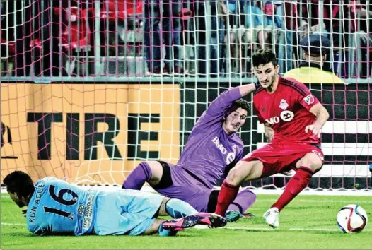  ??  ?? Chris Mannella, right, defends in a recent club game for Toronto FC. The midfielder will play for Canada at the Pan Am Games.