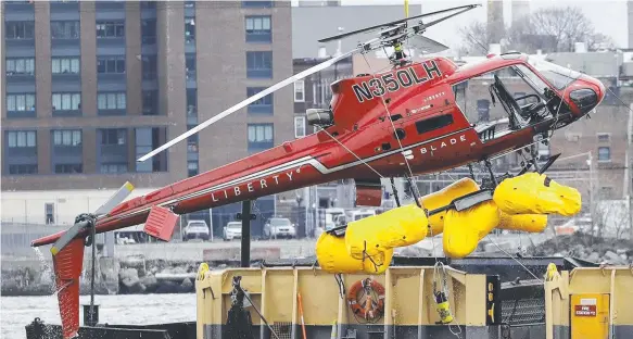 ?? Picture: AP PHOTO ?? A helicopter that crashed into New York’s East River on Sunday, killing all five passengers, is retrieved yesterday.