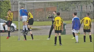  ??  ?? Jordan Norman outjumps the Dumbarton defence to score with a header during the Under 15 League Cup semi final win over Dumbarton United Blacks.