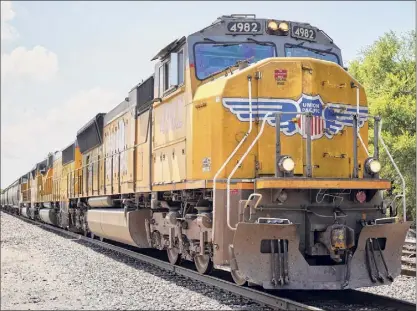  ?? Associated Press archive ?? A Union Pacific train travels through Union, Neb., in 2018. A federal judge has ruled that details of talks among major railroads about freight fees should be included in lawsuits challengin­g the legality of the fees.