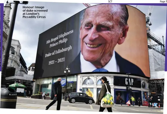  ??  ?? Honour: Image of duke screened at London’s Piccadilly Circus