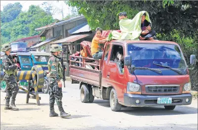  ?? ROMEO RANOCO / REUTERS ?? Government troops check a vehicle evacuating residents from their hometown of Marawi in southern Philippine­s, on Wednesday.