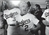  ?? MCT ?? Los Angeles Dodgers Managertom­my Lasorda celebrates winning the five game National League playoff series against the Houston Astros on Oct. 11, 1981.