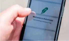  ?? Photograph: Jim Watson/AFP/Getty Images ?? The Robinhood investment app had a waiting list last week of more than 250,000 people in the UK.