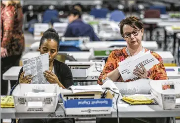  ?? JOHN SPINK / JSPINK@AJC.COM / 2018 ?? A lawsuit filed Wednesday by the Democratic Party seeks to require that Georgia voters whose absentee ballots are rejected be notified in time to correct problems and ensure their votes are counted.