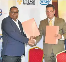  ?? /Supplied ?? Web work: National Museum of Kenya directorge­neral Mzalendo Kibunjia, left, and Digital Data Divide president Frank Heitmann seal a deal to digitise collection­s.