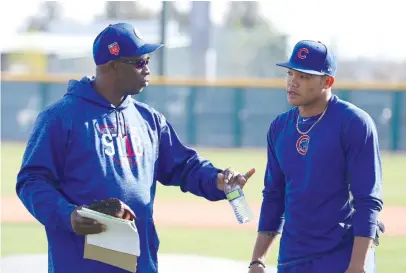  ?? JOHN ANTONOFF/FOR THE SUN-TIMES ?? Former Cubs hitting coach Chili Davis, talking to Addison Russell during spring training, seemed well-liked.