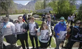  ?? (AP/Rick Bowmer) ?? Protesters stand in solidarity with rape victims on the campus of Brigham Young University during a sexual assault awareness demonstrat­ion on April 20, 2016 in Provo, Utah.