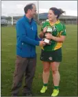  ??  ?? Knockanann­a captain Aine O’Keeffe collects the Senior league cup from Wicklow Camogie Chairman Serge Goetelen.
