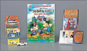  ?? [VICTORIA GRAY/ THE STRONG, NATIONAL TOY HALL OF FAME VIA THE ASSOCIATED PRESS] ?? In this Oct. 7 photo provided by the National Toy Hall of Fame, Matchbox Cars, left, the coloring book, center, and the collectibl­e card game Magic: The Gathering were inducted into the National Toy Hall of Fame in Rochester, N.Y.