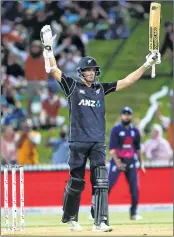  ??  ?? Mitchell Santner celebrates hitting the winning runs during the first ODI match against England at Seddon Park in Hamilton on Sunday.