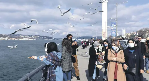  ??  ?? People spend time near the sea amid the coronaviru­s restrictio­ns, Üsküdar district, Istanbul, Turkey, Feb. 25, 2020. (Reuters Photo)