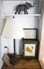  ??  ?? Shelving cleverly uses the space in the tiny room to display knickknack­s and memorabili­a.