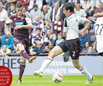  ??  ?? n Hearts’ midfielder Jamie Walker scores the opening goal of the game after 18 minutes.