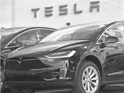  ??  ?? While Tesla grapples with internal issues like production delays, a sometimes-erratic CEO and a recent about-face on whether to go private, its rivals are moving aggressive­ly into the luxury electric vehicle space. DAVID ZALUBOWSKI / AP