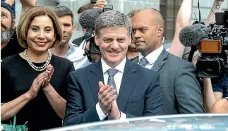 ?? KEVIN STENT/FAIRFAX NZ. ?? Okay, now for the hard part. Bill English and his wife Mary farewell John Key at Parliament on Monday.