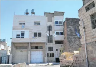  ??  ?? The Abu Rajab house, where 200 Jewish settlers arrived last week on their doorstep, entered the garden and tried to break into the basement.