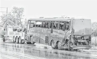  ?? Danny Zaragoza / Laredo Morning Times ?? A charter bus carrying about 50 passengers rolled over north of Laredo on Saturday, killing eight people. The bus, which originated in the Rio Grande Valley, was headed to a casino in Eagle Pass.