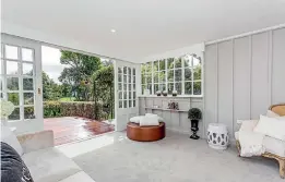  ??  ?? Large windows, garden views and the calming white palette make this home a serene space for the family.