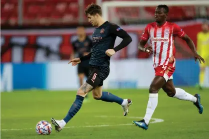  ??  ?? John Stones impressed for Manchester City during their Champions League win at Olympiakos. Photograph: MB Media/Getty Images