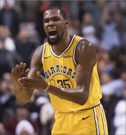  ?? PHOTOS BY NATHAN DENETTE — THE CANADIAN PRESS VIA AP ?? Kevin Durant’s 51 points helped rally the Warriors and send the game into overtime. He’s scored at least 40 points in the past three games.