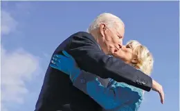  ??  ?? SEALED. Joe Biden kisses his wife, Jill, after being sworn in as president.